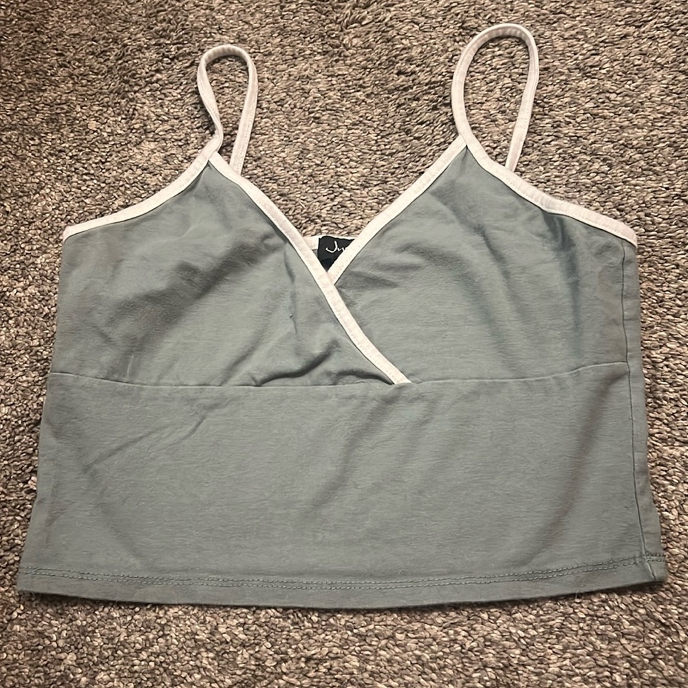 Tank top. Blueish green color tank top with white outline on top.